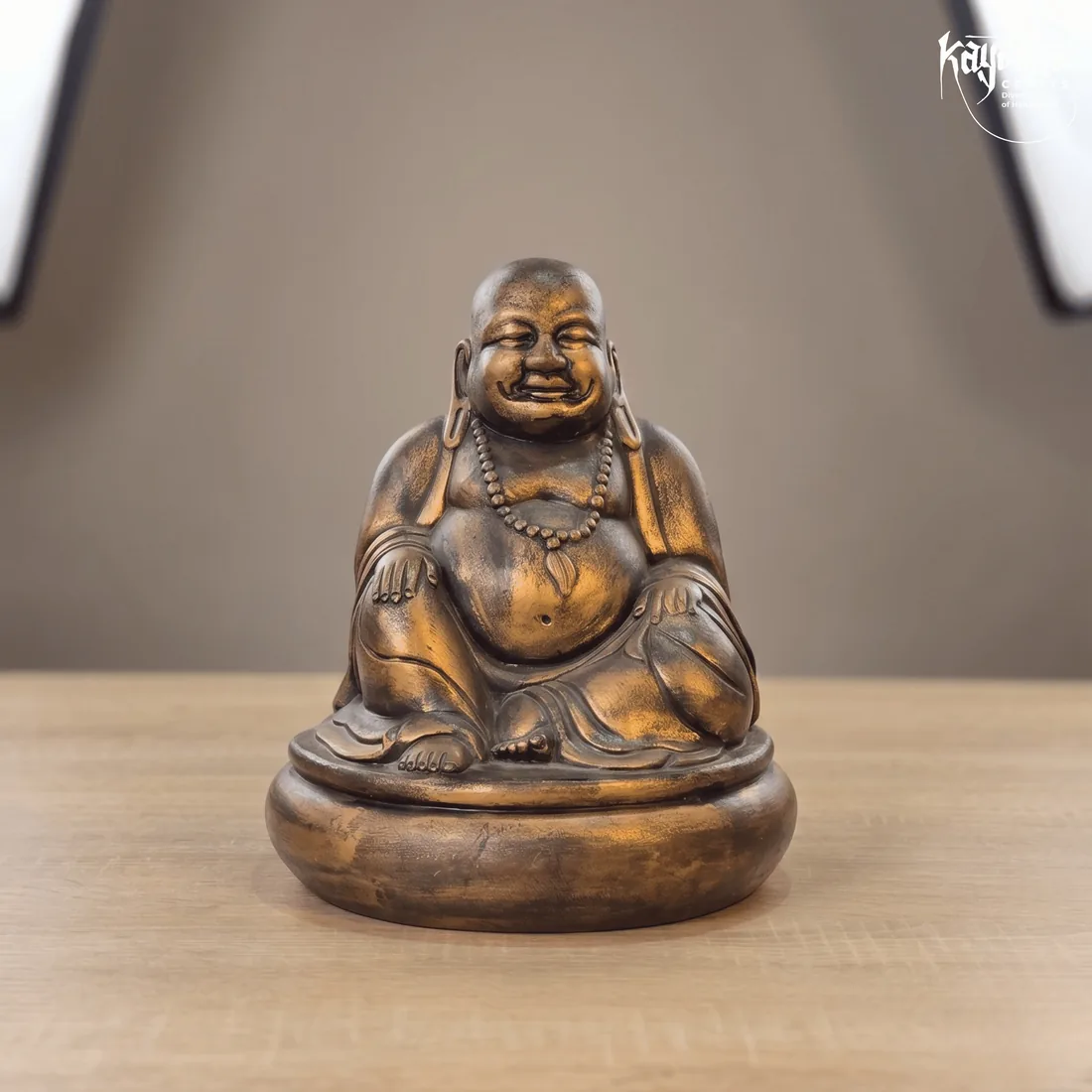 Terracotta laughing Buddha statue